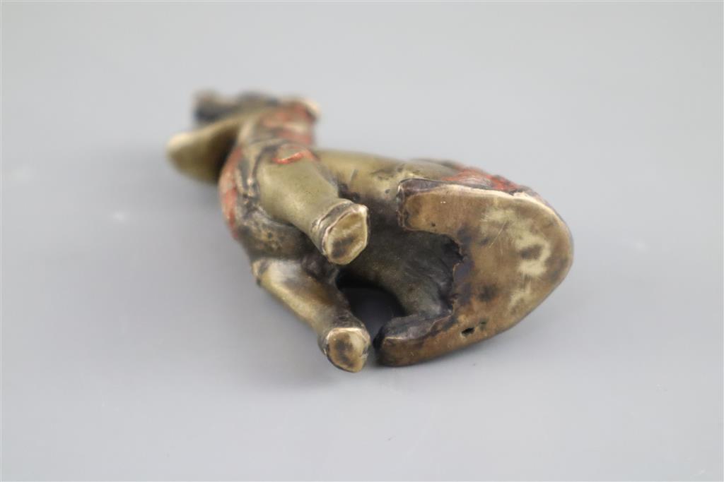 A Chinese bronze qilin scroll weight, 17th century, 8cm high